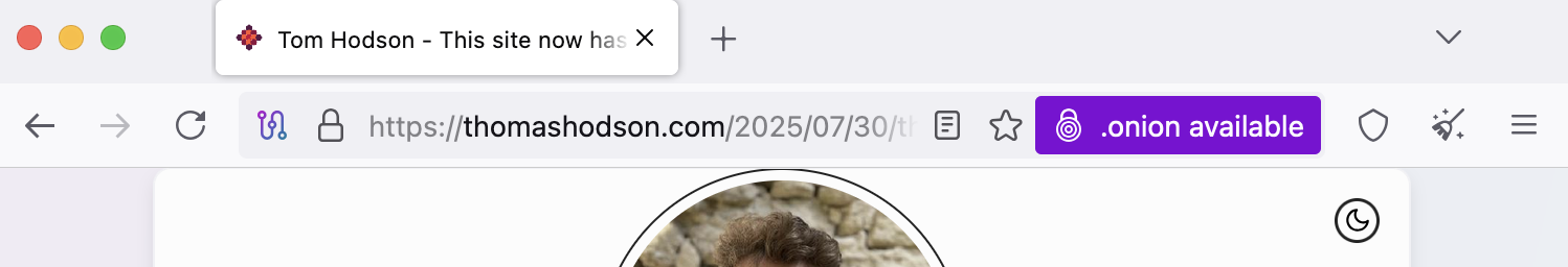 A screenshot of the area around the url bar of a tor browser opened to thomashodson.com showing that you get a purple button to the right that says '.onion available'