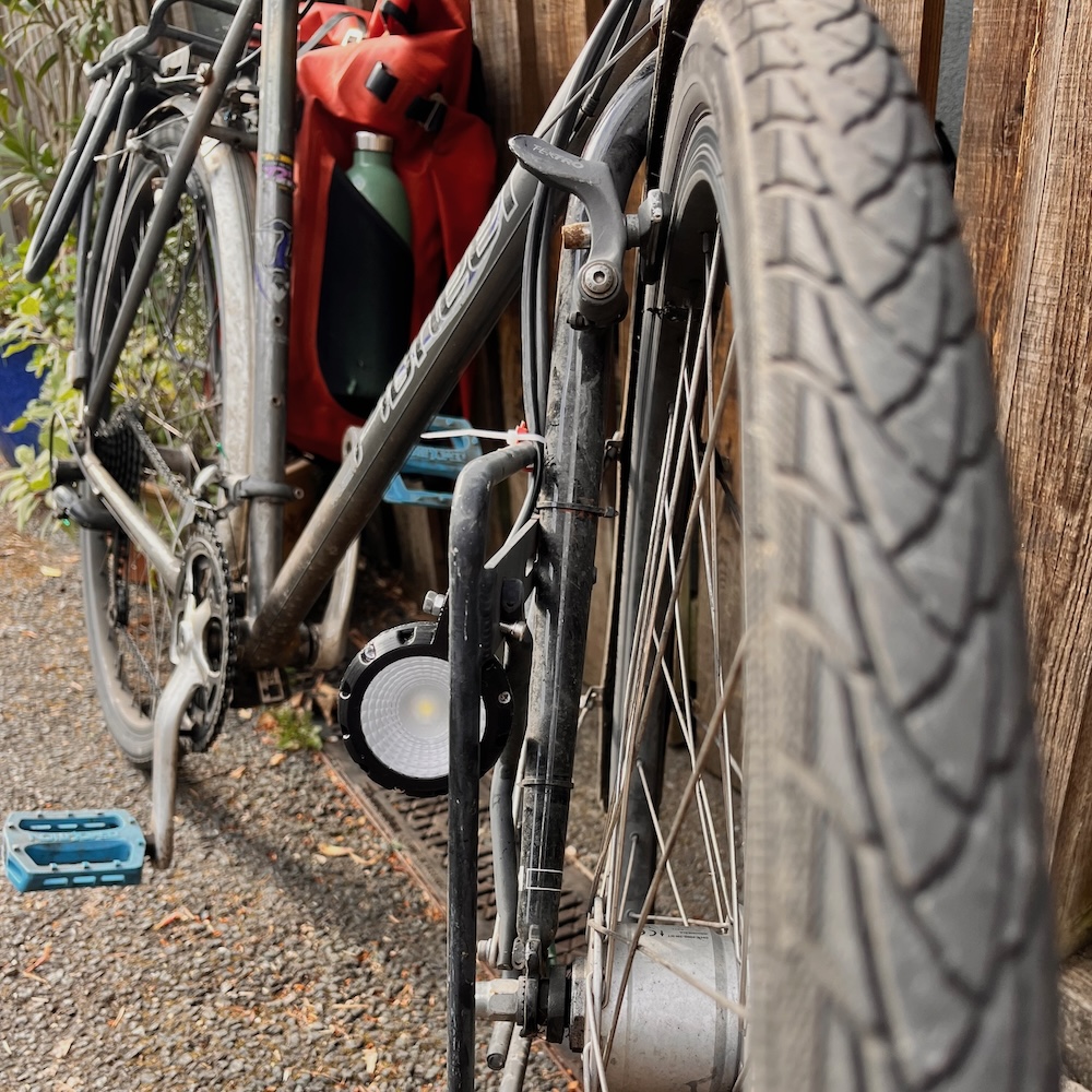 A front shot of the light mounted on my bike very jankily with a bolt.